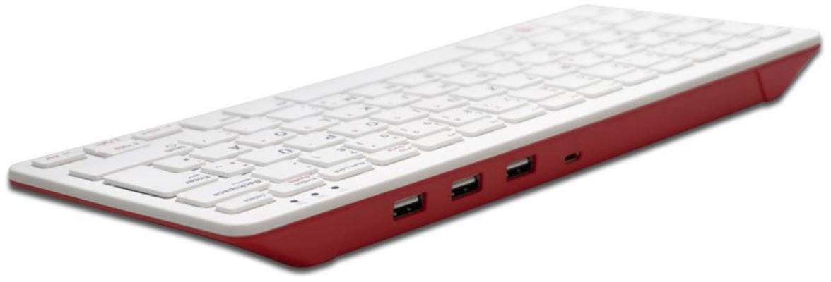 Vit tangentbord med röda accenter, lutande åt sidan, visar tre USB-portar på höger sida.