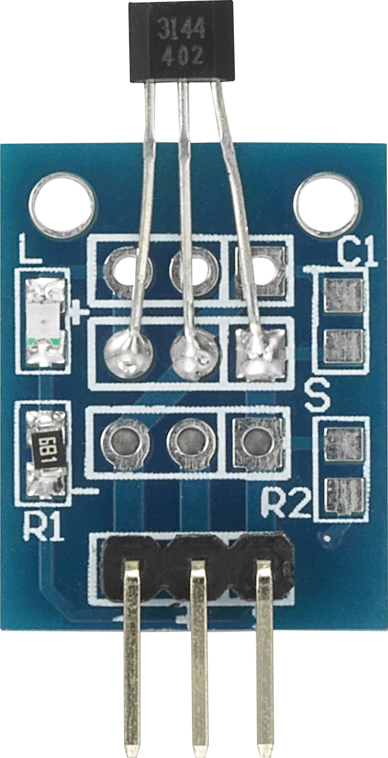 Blått elektronikmodul med transistor och olika komponenter som motstånd och stiftlister.
