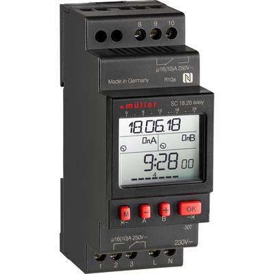 Elektronisk tidur i svart med röd display, visar tid och datum. Tillverkad i Tyskland.