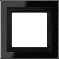 Svart fyrkantig ram med vit insida. Passar för montering av strömbrytare eller eluttag inomhus.
