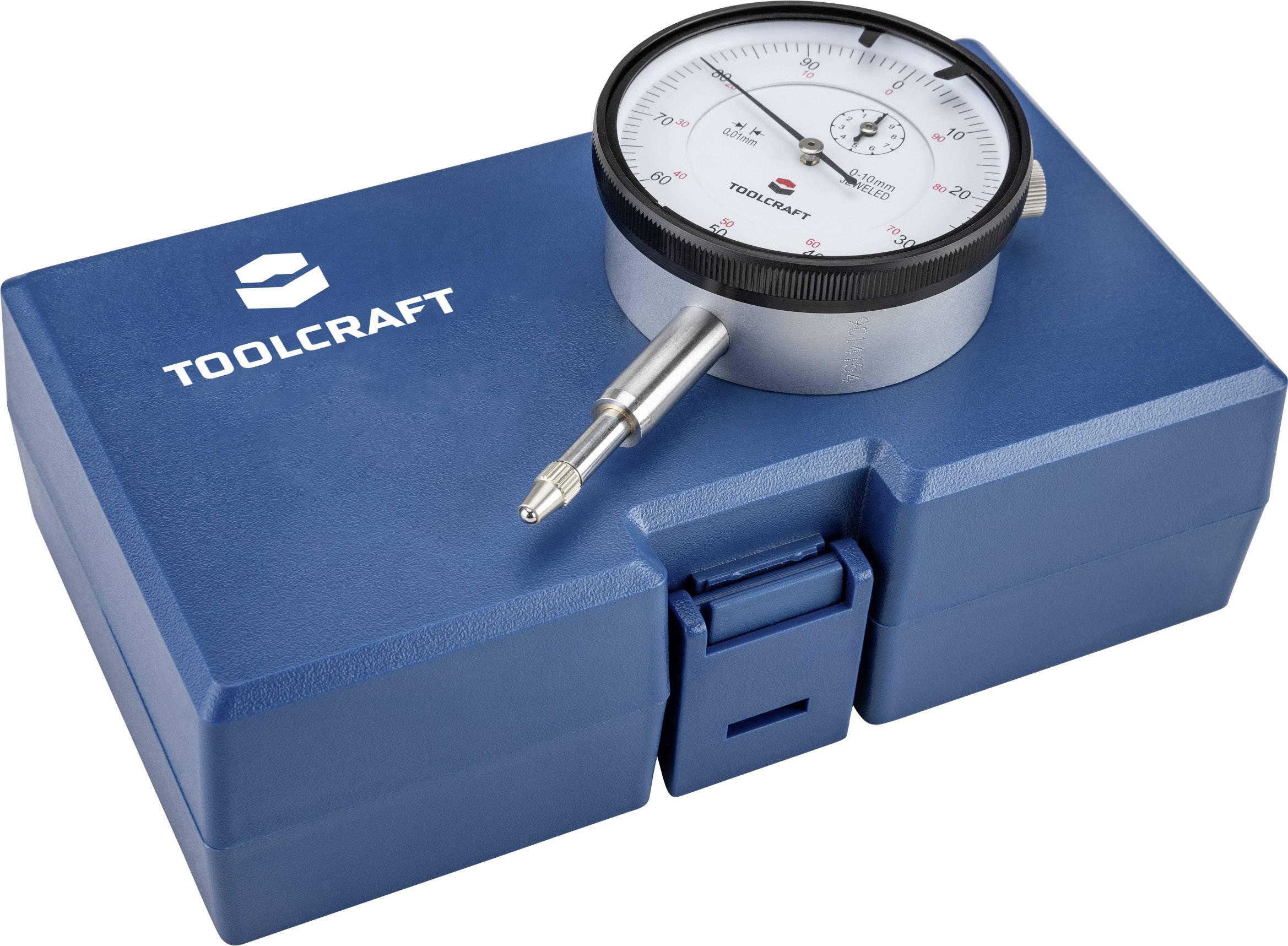 En mätklocka på en blå TOOLCRAFT-väska, använd för exakt mätning av längdavvikelser i tekniska tillämpningar.