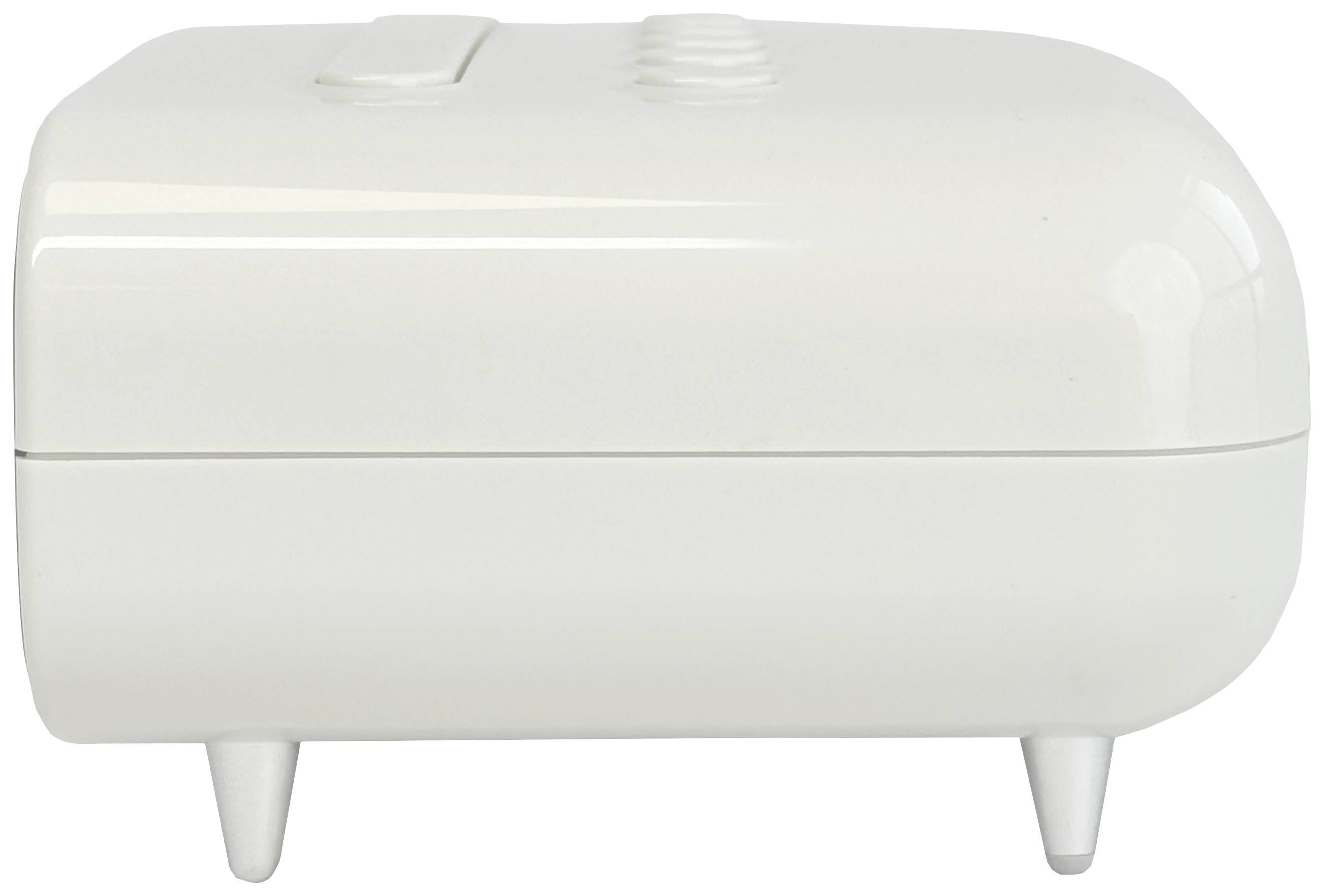 En vit, rektangulär, slät låda med fyra små ben, fotograferad från sidan. Den har två synliga knappar på ovansidan.