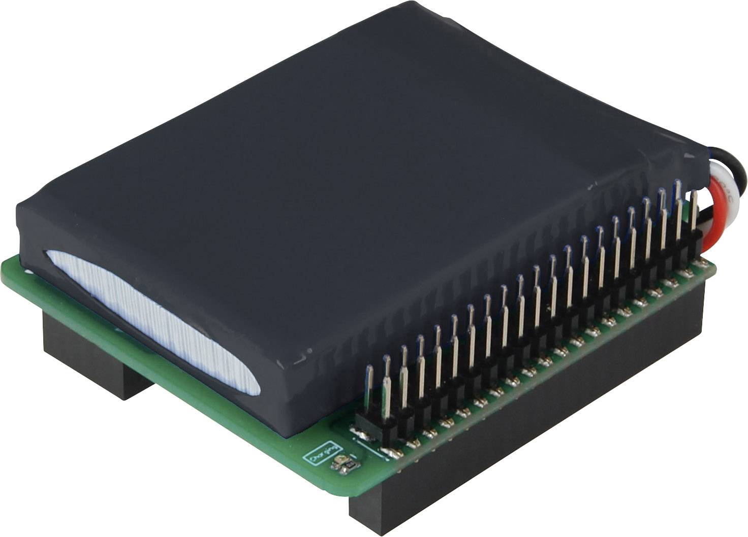 Svart elektronikmodul med många stift på ett grönt kretskort, sedd från sidan, visar teknisk komponent.