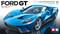 Blå Ford GT sportbilsmodell från Tamiya i skala 1:24, fotograferad framifrån vänster, på reflekterande yta. Tamiya-logotyp nere till höger.