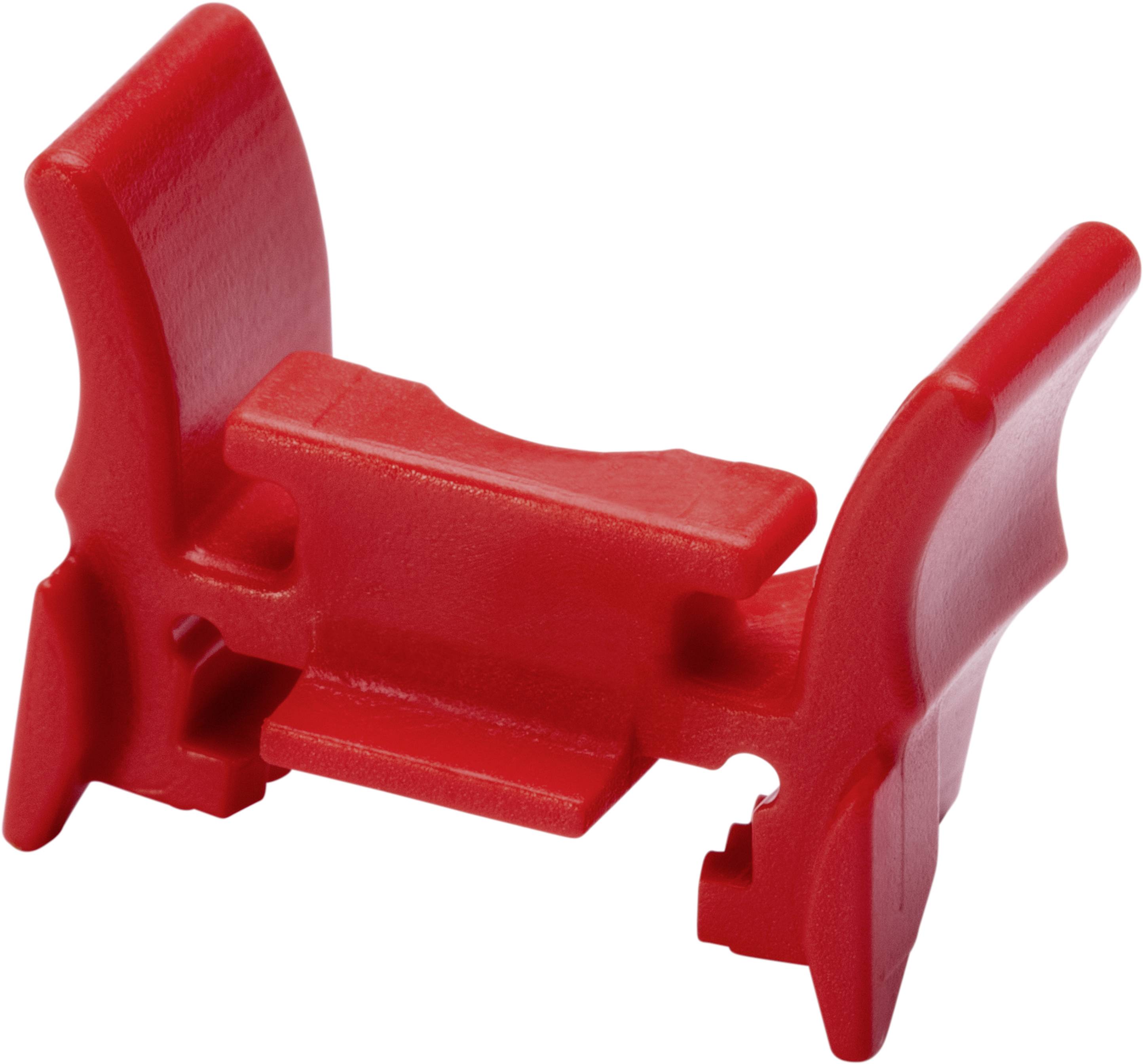 En röd plastdetalj med vingformade element och ett centralt stöd.