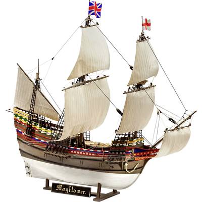 En modellbåt med vita segel och färgade dekorationer. Två flaggor vajar högst upp. En skylt med 'Mayflower' vid basen.
