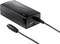 Svart nätadapter med USB-port och kabel. Märkning 'Voltcraft' synlig.