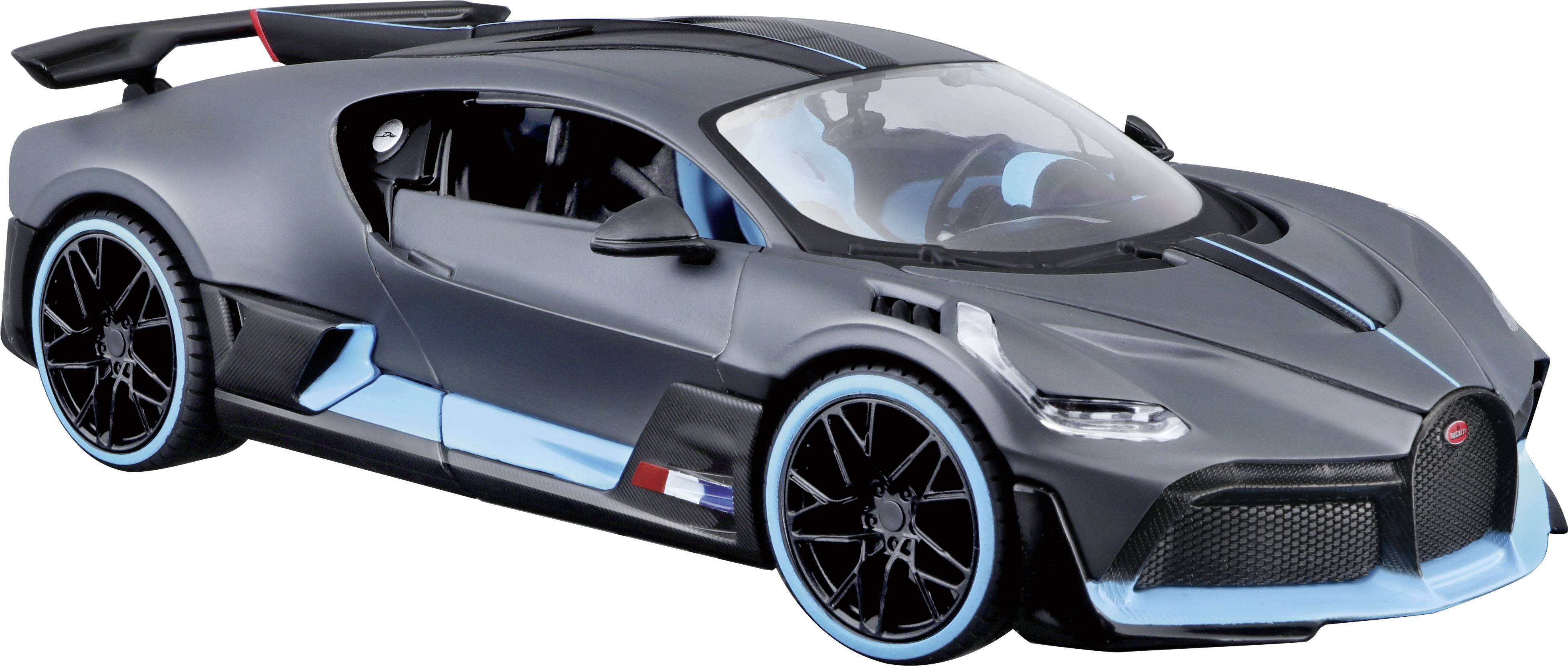 En modern, sportig bil i mörka färger med blå accenter. Den har en aerodynamisk design och en låg kaross.