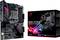 Moderkort ASUS ROG Strix B550-F Gaming bredvid förpackningen. Svart med rosa LED-accenter. Spelcentrerad, stöder Ryzen-processorer.