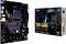 En ASUS TUF Gaming B550-Plus moderkort bredvid sin förpackning. Moderkortet har flera PCIe-platser och kylflänsar.
