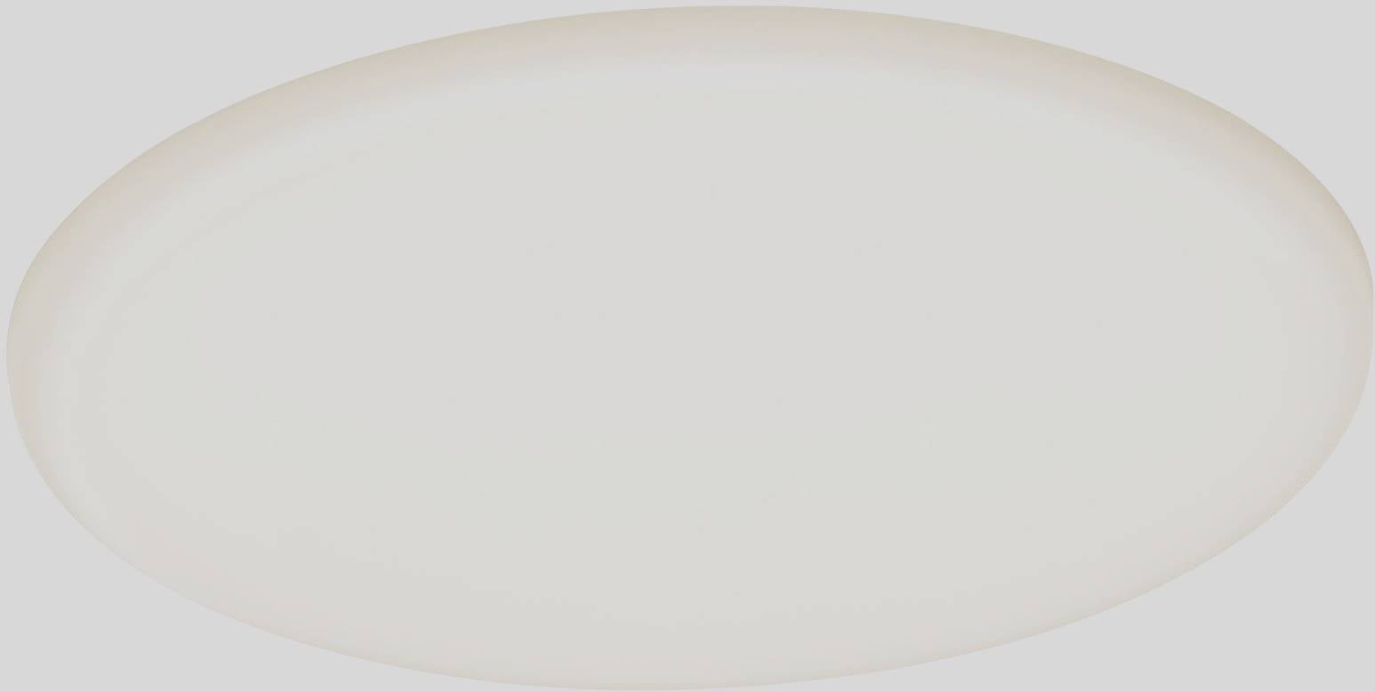 En oval, vit tallrik framför en grå bakgrund.