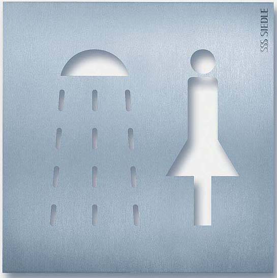 En piktogram med en dusch och en stiliserad person på en metallplatta, symboliserar en damdusch.