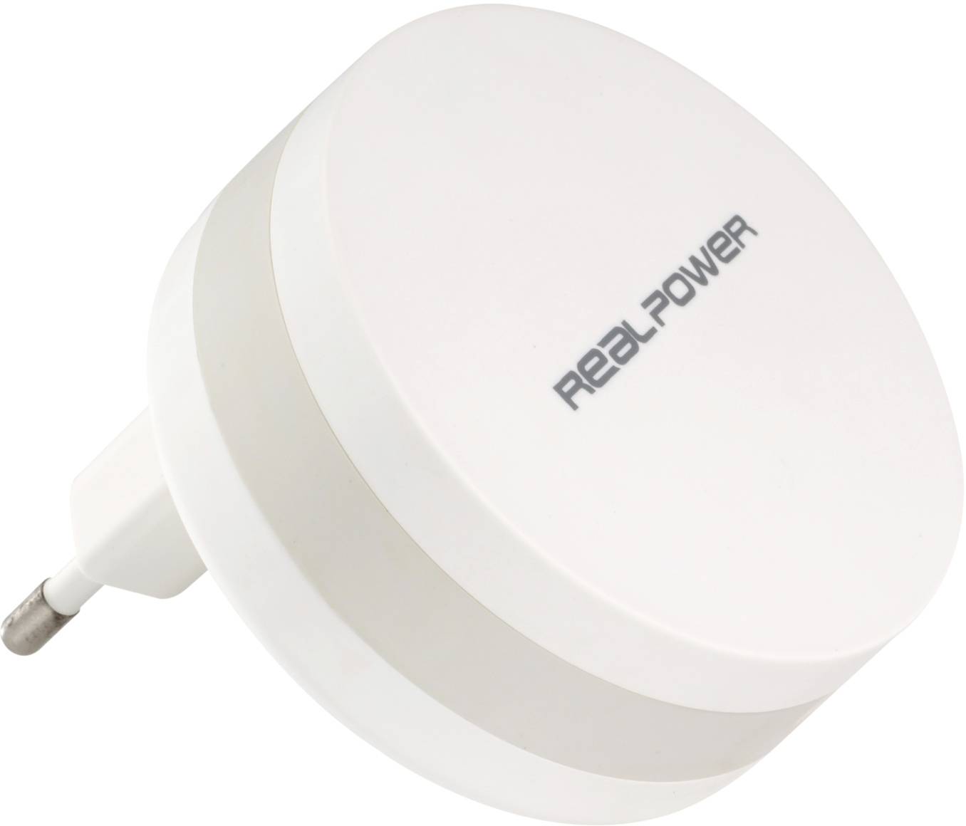 En vit, rund laddare med texten 'Real Power'. Den har en kontakt för vägguttaget och framstår som kompakt och modern.