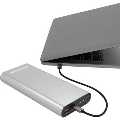 En bärbar dator får ström via en USB-kabel från en silver powerbank.