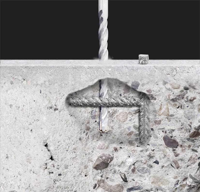 Borren tränger genom betong och skapar ett jämnt hål. Närbild som visar betongens detaljerade struktur och borrningens precision.