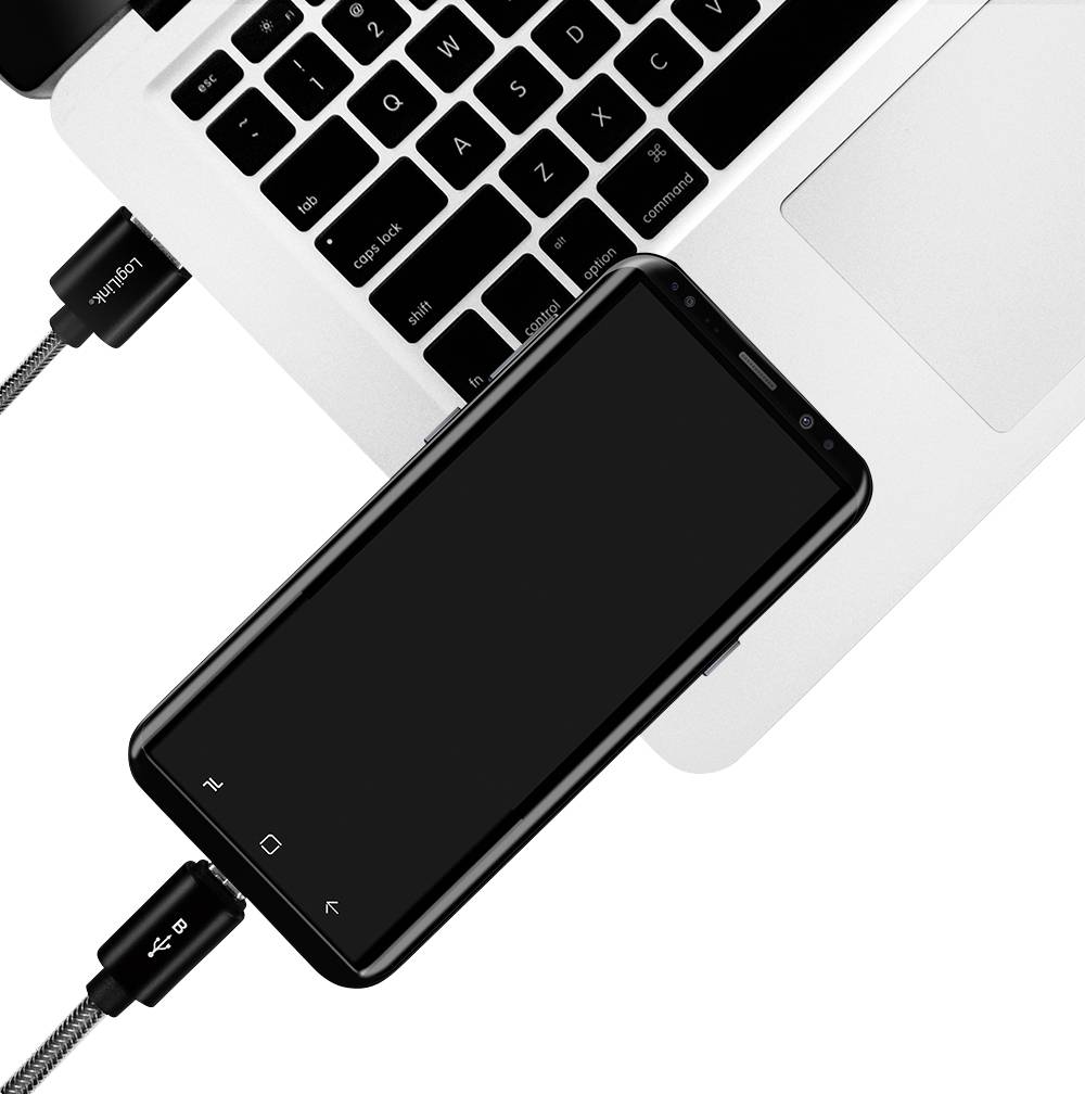 En smartphone är ansluten till en bärbar dator via en USB-kabel, vilket visar hur enheter kan länkas för dataöverföring eller laddning.