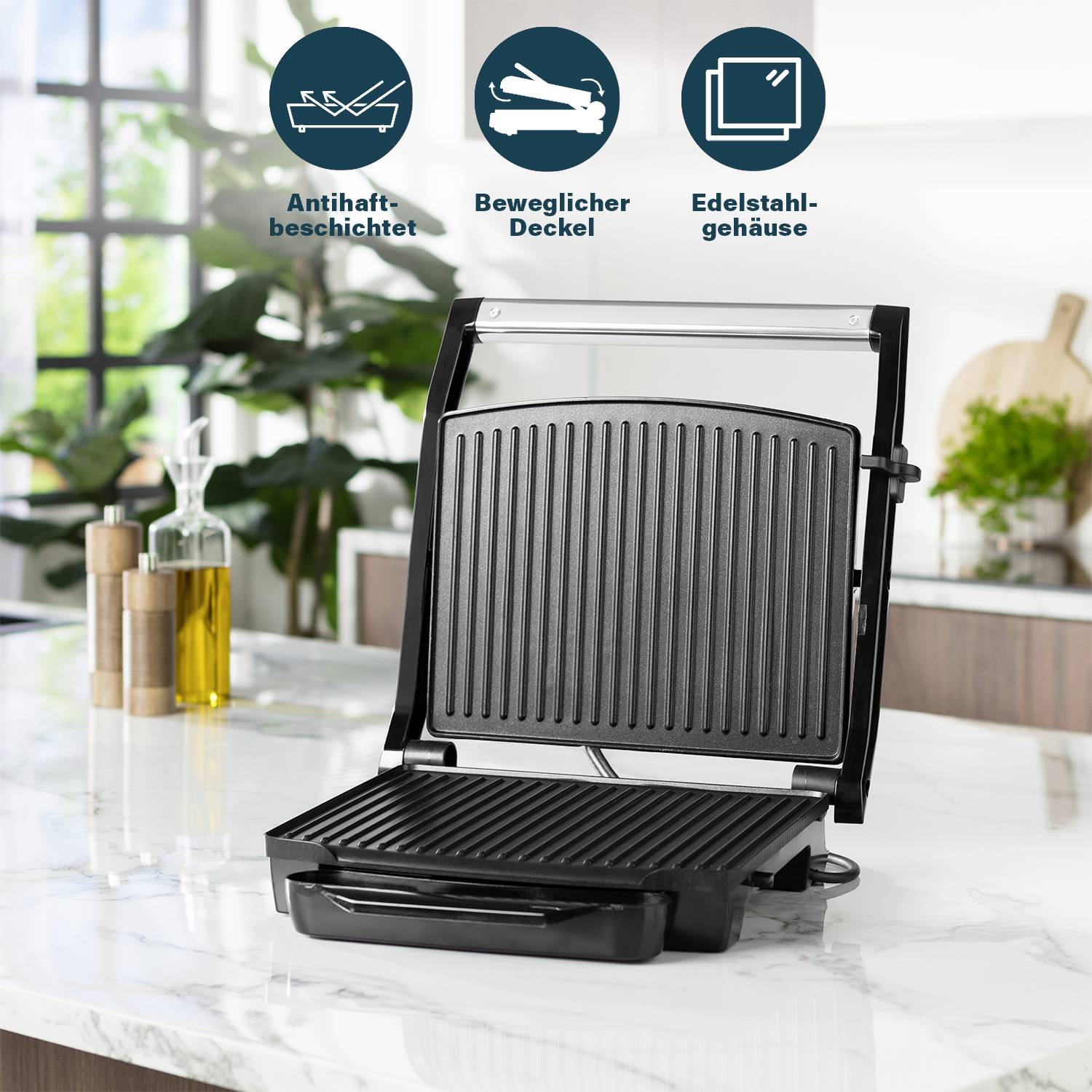 En lättrent kontaktgrill med non-stick-belagd yta, rörlig lock och hölje av rostfritt stål, placerad i ett modernt kök.