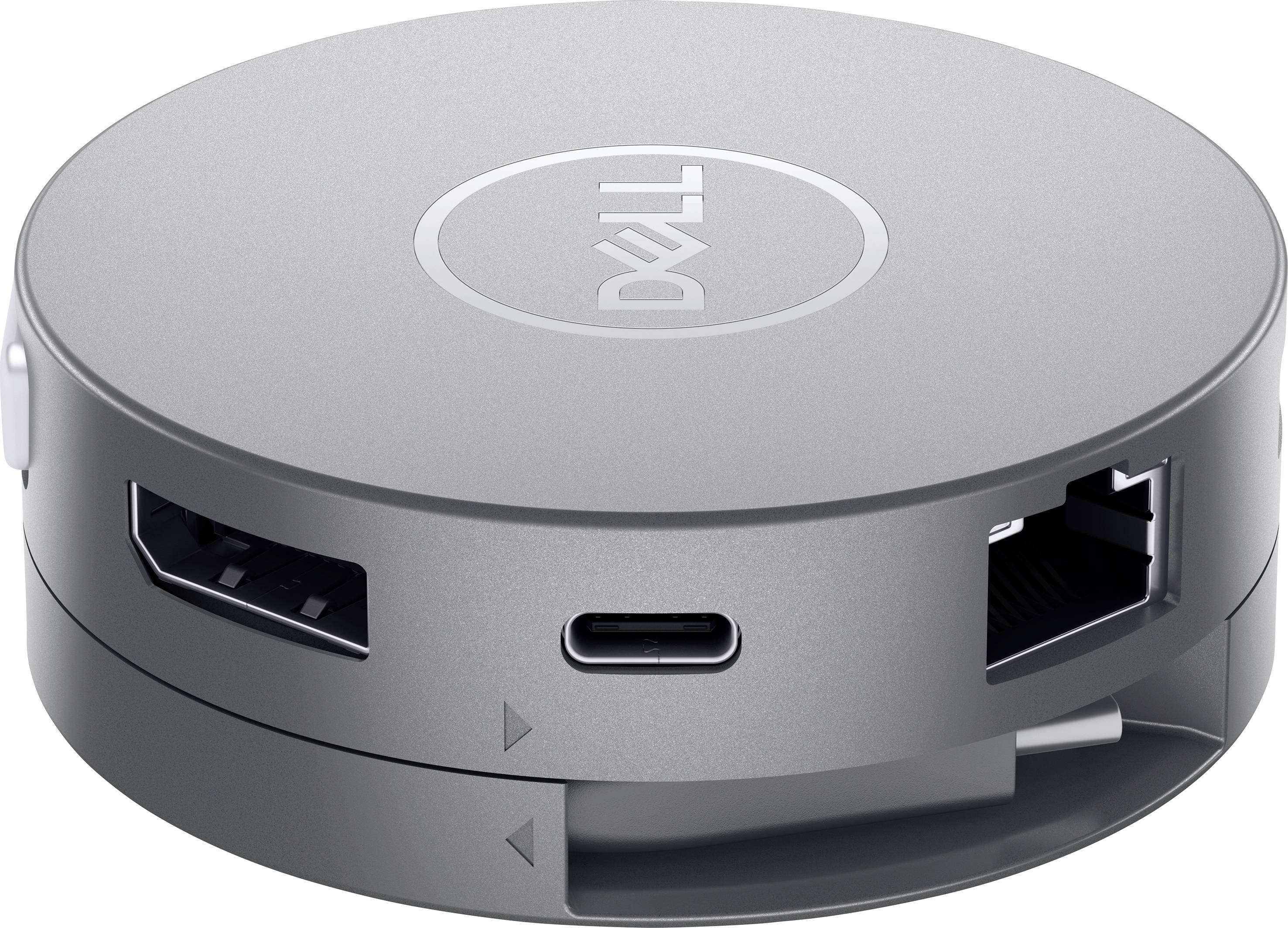 En rund, silverfärgad adapter med Dell-logotyp, utrustad med flera portar inklusive USB-C och Ethernet-anslutning för anslutningsändamål.
