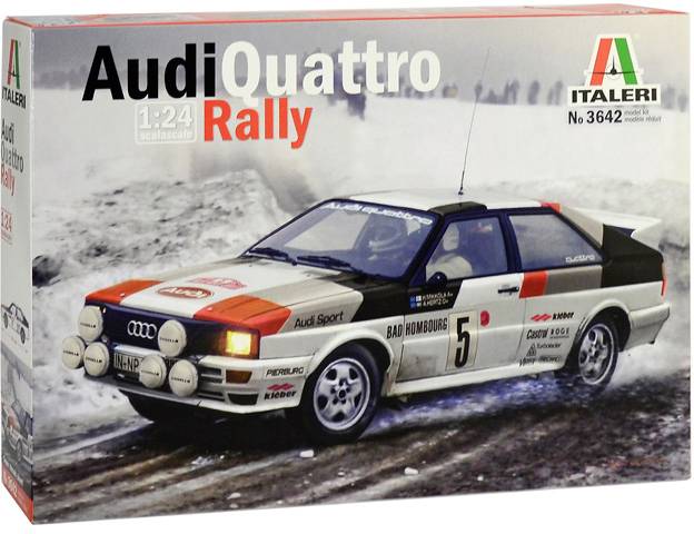 En modellbilssats visar en Audi Quattro rallysportbil på en snötäckt sträcka. Kända märkeslogotyper och startnummer 5.