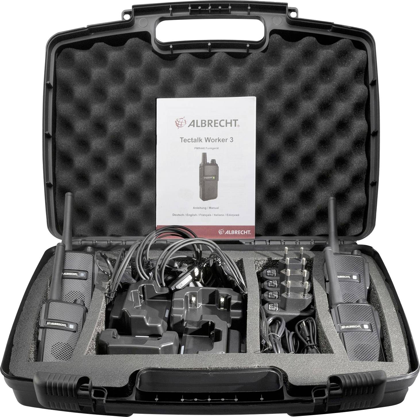 Väska med två walkie-talkies, laddare och tillbehör organiserade i skuminsatser. En instruktionsmanual med titeln 'Tectalk Worker 3' är synlig.