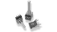 Tre olika elektroniska omkopplare: en potentiometer, en vippströmbrytare och en fyrkantig trycknapp, i närbild.