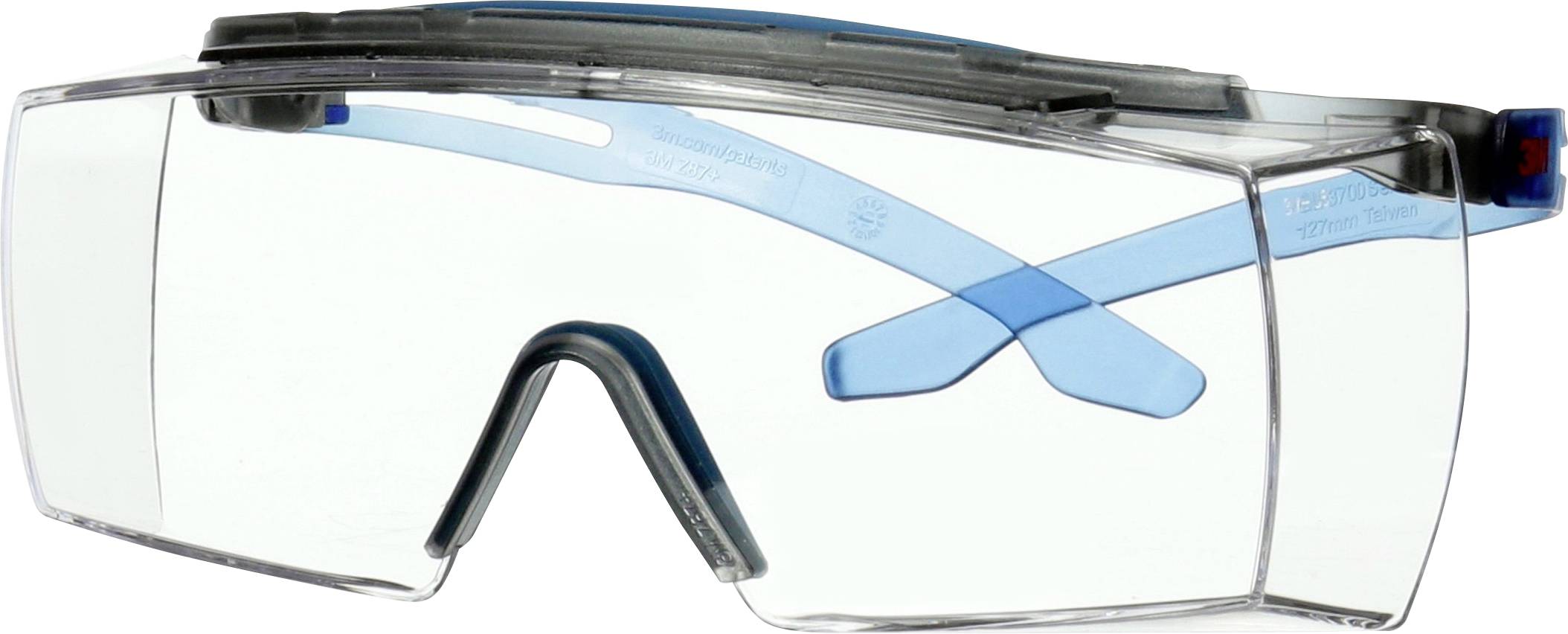 Skyddsglasögon med transparent glas och blå bågar, utformade för ögonsskydd i industriella eller vetenskapliga miljöer.