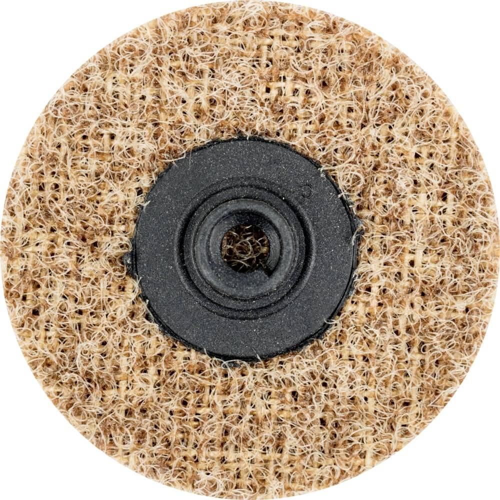 Närbild av en rund, grov skiva med ett centralt hål och strukturerad yta, troligen ett slippad eller poleringstillbehör.