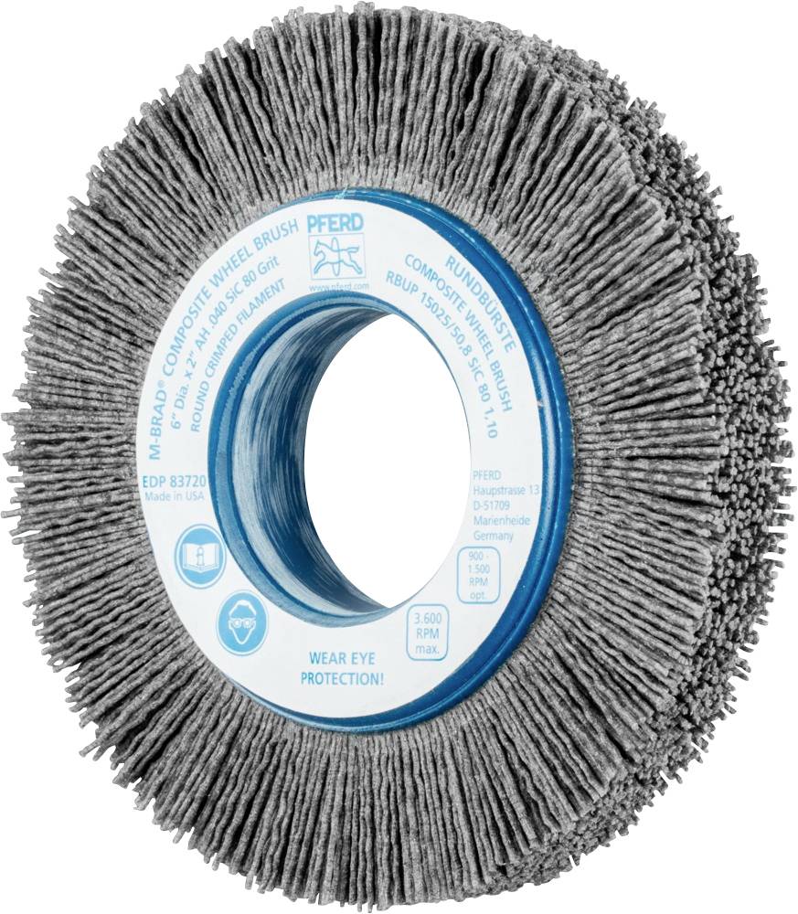 Rund slipskiva med borstad yta av grått material och blå mitt. Säkerhets- och produktinformation finns angiven på ytan.