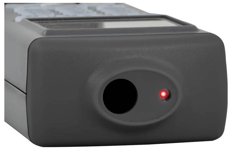 Svart elektronisk enhet med en cirkulär framöppning och ett litet rött indikatorljus