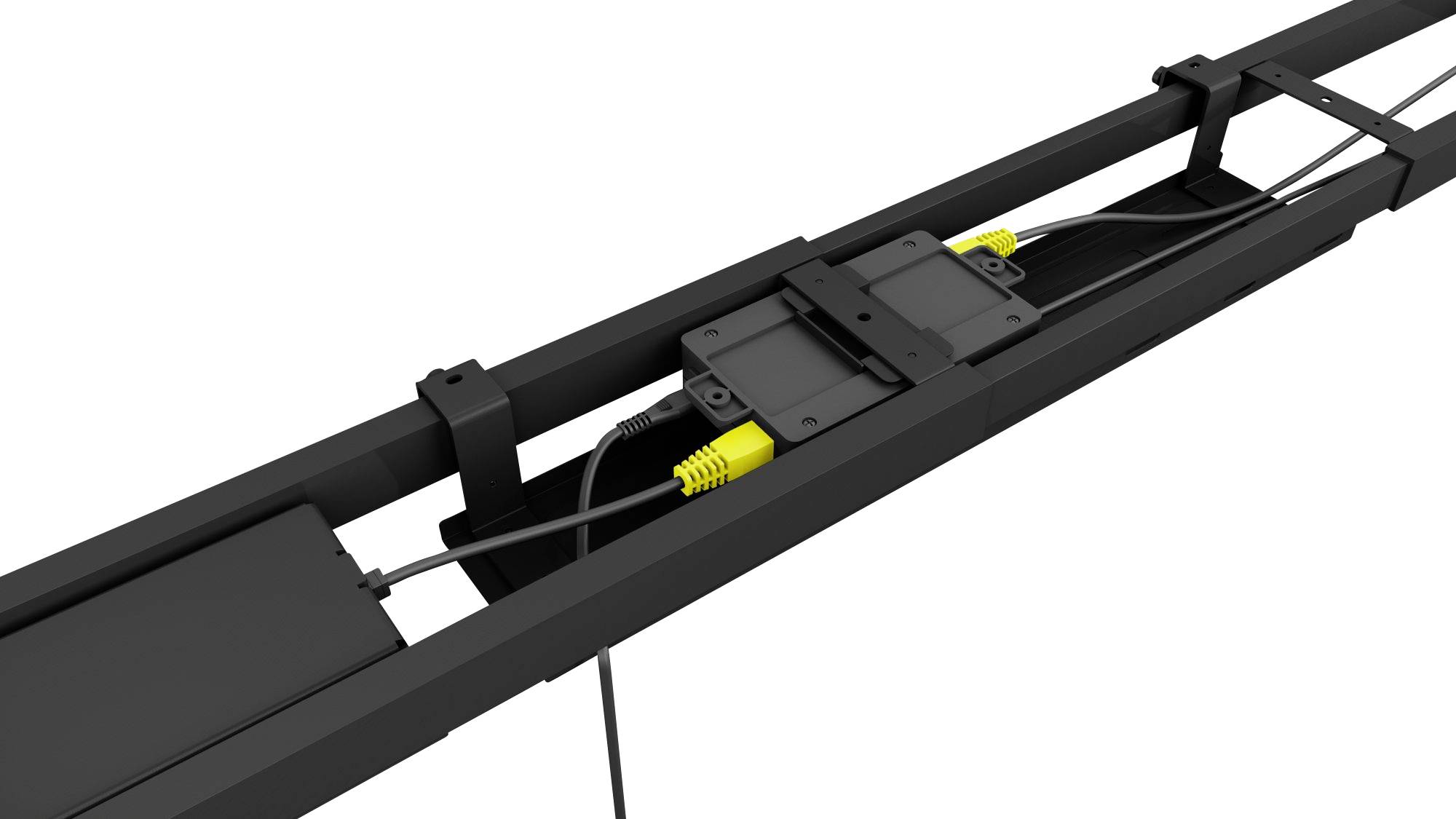 En svart, rektangulär enhet med gula kablar är fäst i mitten av en svart ram. Den verkar vara en del av en teknisk apparatur.