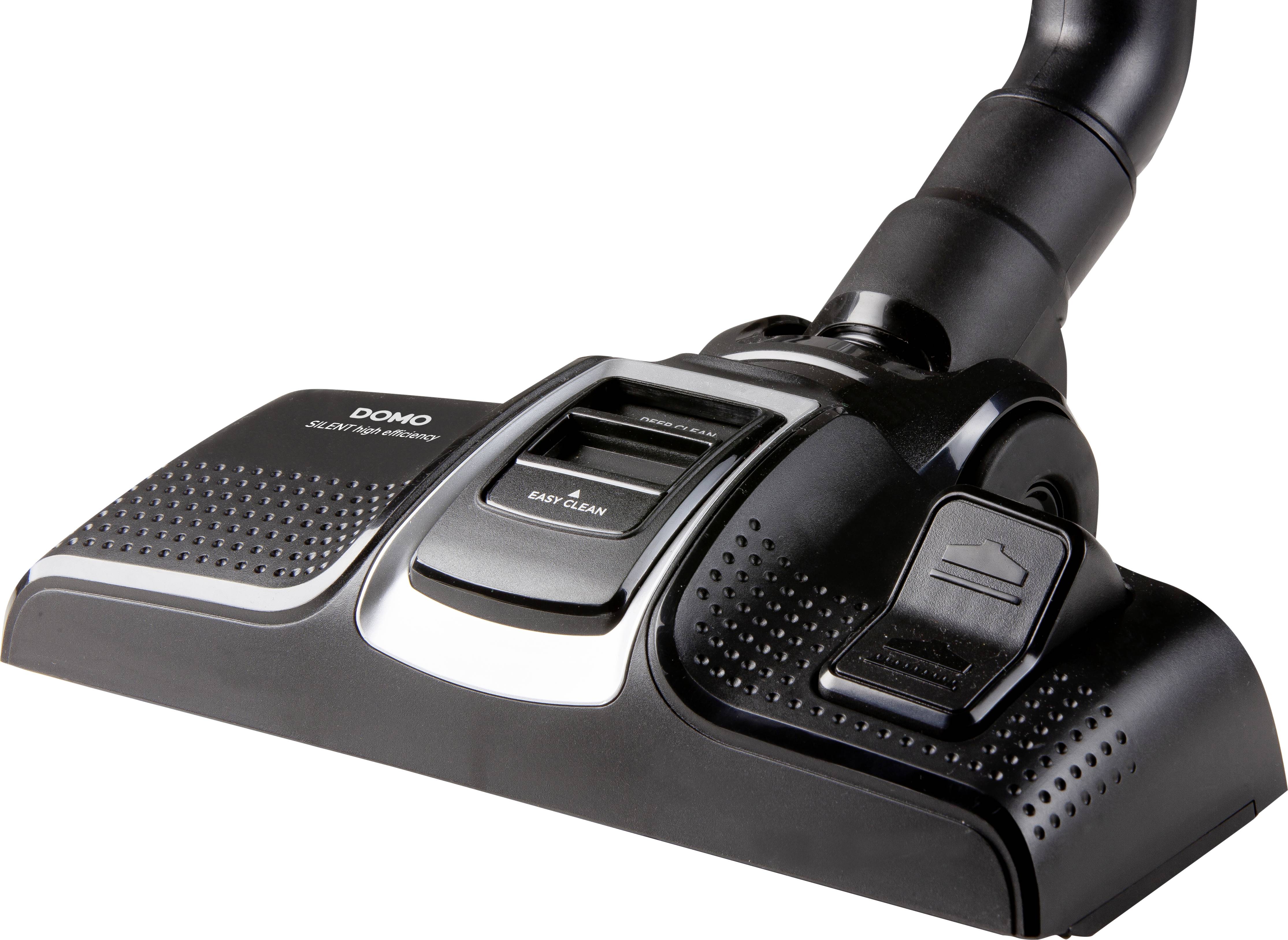 Ett svart dammsugarhuvud med olika inställningsalternativ och en spak för rengöring av mattor eller hårda golv.