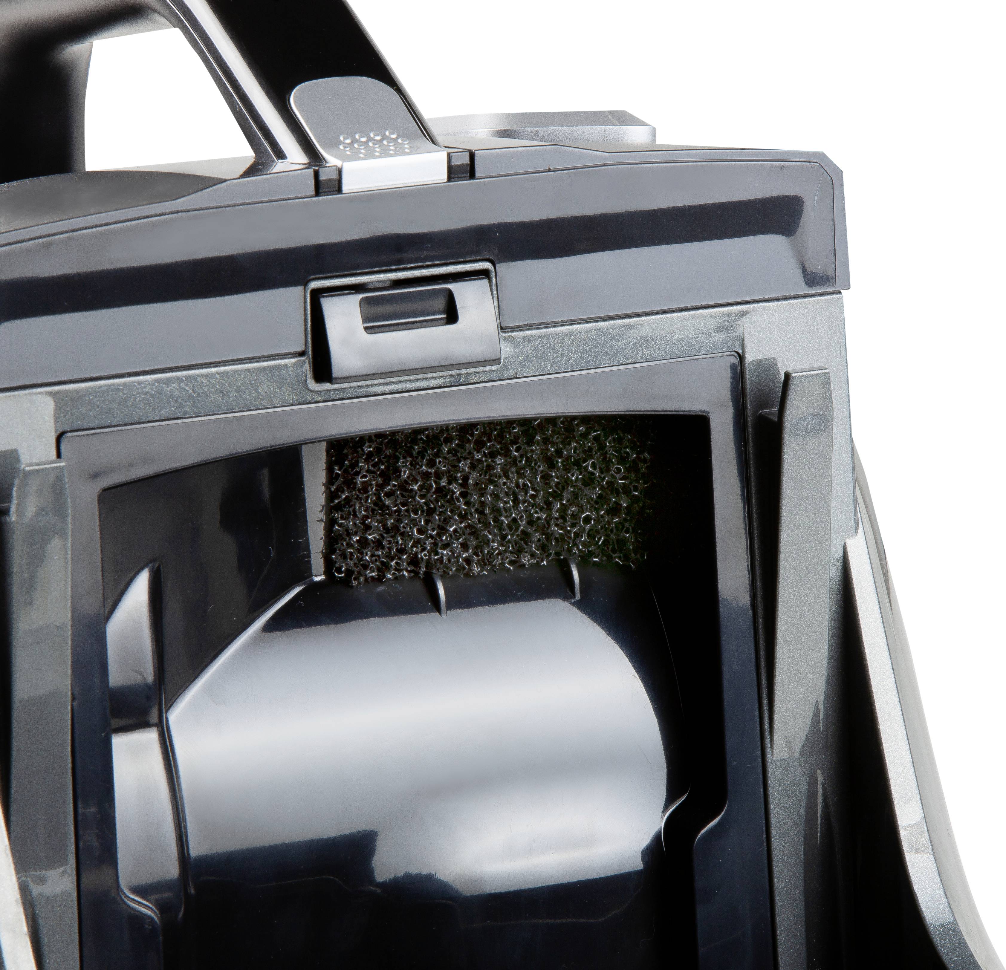 Närbild av en dammsugarfilter med svart skum och plastinkapsling.