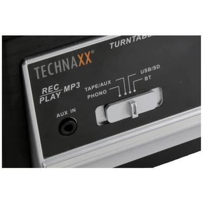 Kontroller på en skivspelare med märkningar för 'Phono', 'USB/SD', 'BT', 'Aux In'. Märke: TECHNAXX.