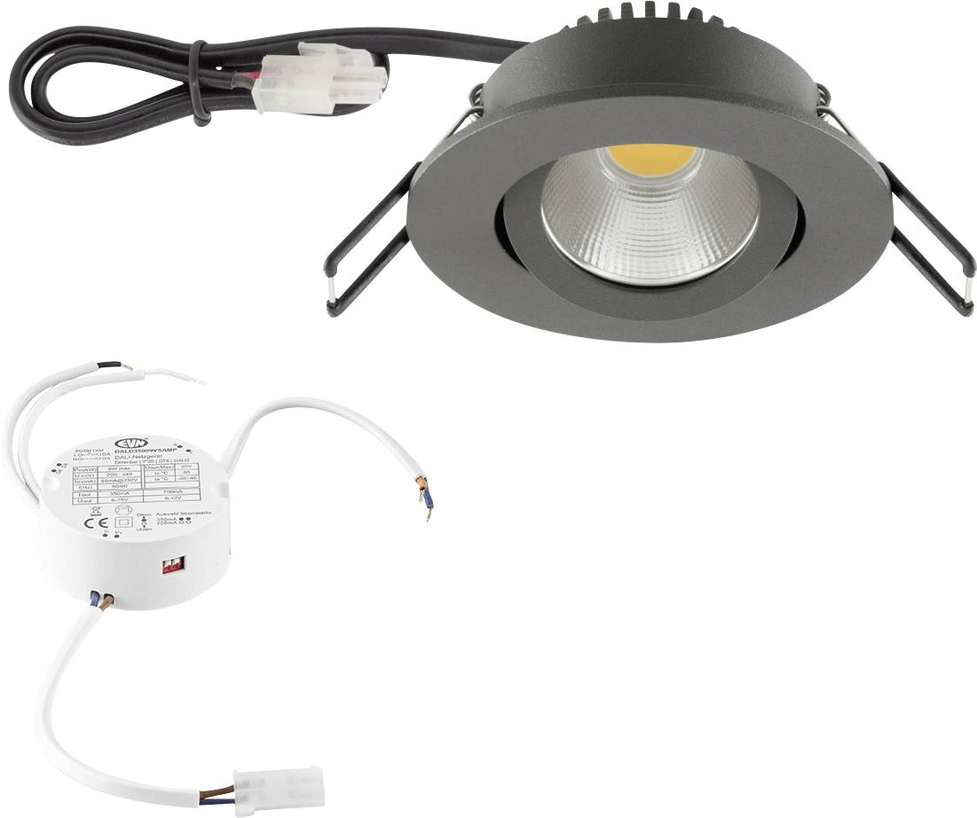Inbyggd LED-spotlampskit med svart ring, strömförsörjning och anslutningsdon visad på vit bakgrund.
