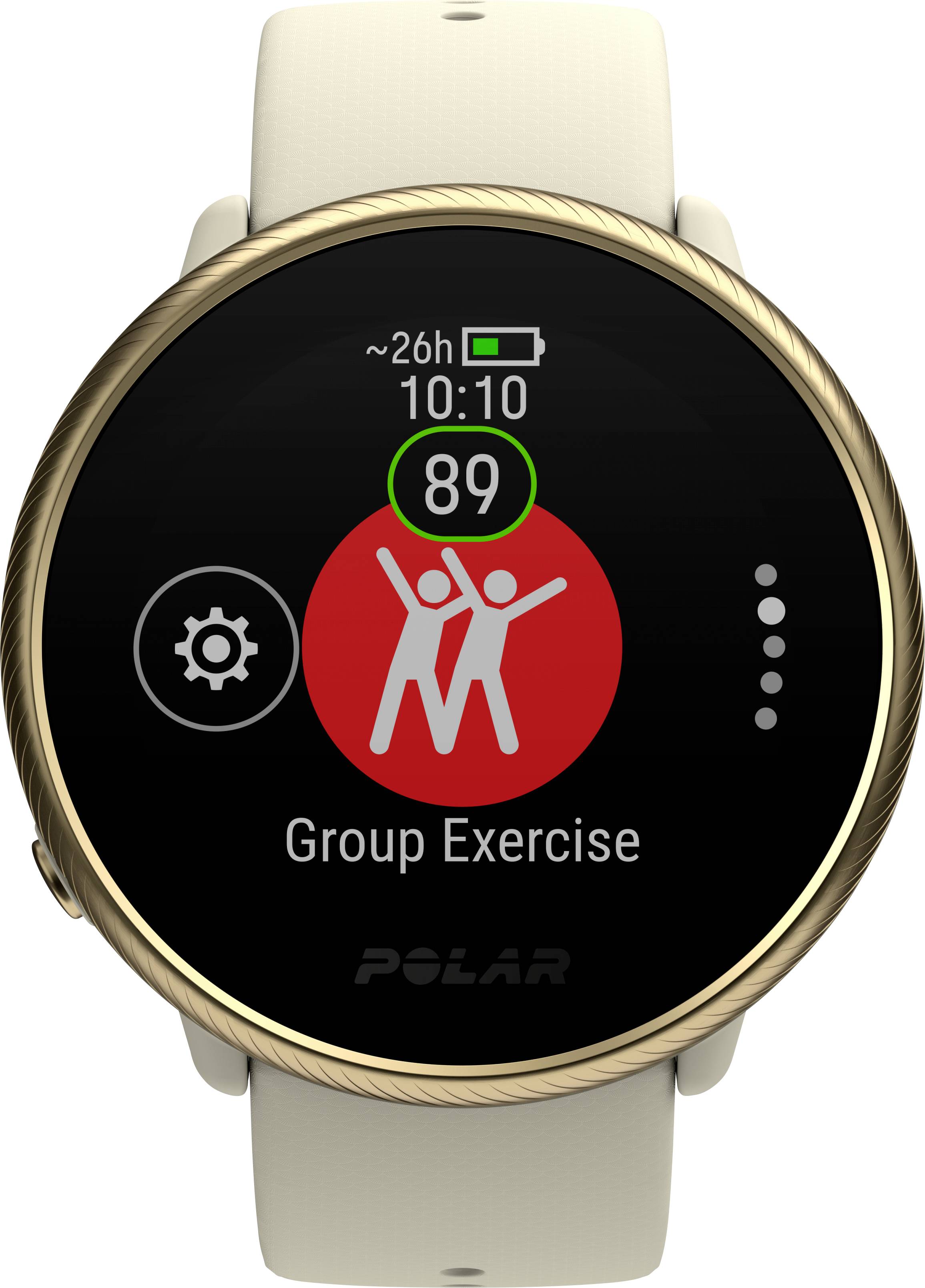 En smartwatch visar displayen 'Group Exercise' med en röd grafik av två personer, 89 hjärtfrekvens och ~26h batteritid.