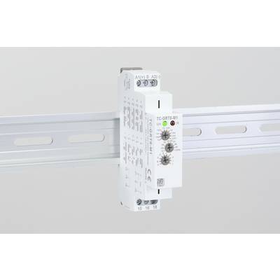 En elektronisk enhet med vridpotentiometrar är monterad på en DIN-skena. Den har LED-displayer och tekniska märkningar.