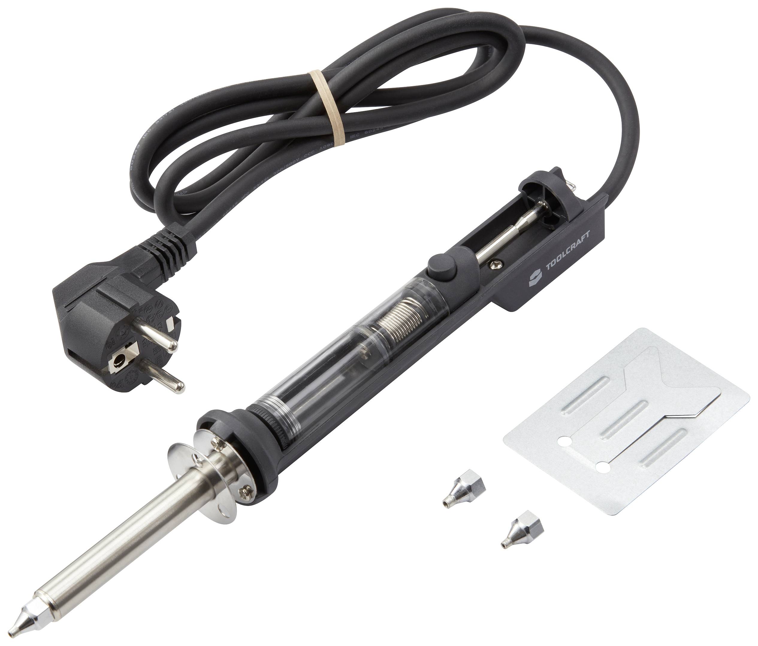 Lödkolv med kabel och två reservspetsar, bredvid en metallhållare. Lämplig för elektroniska reparationer och hobbyarbeten.