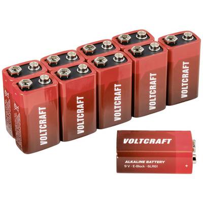Nio röda 9-volts-batterier av märket 'Voltcraft', arrangerade i två rader. Ett enskilt batteri ligger framför.