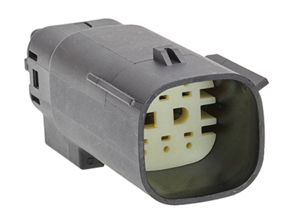 Bild av en elektrisk kontakt, cylindrisk form med flera stift invändigt.