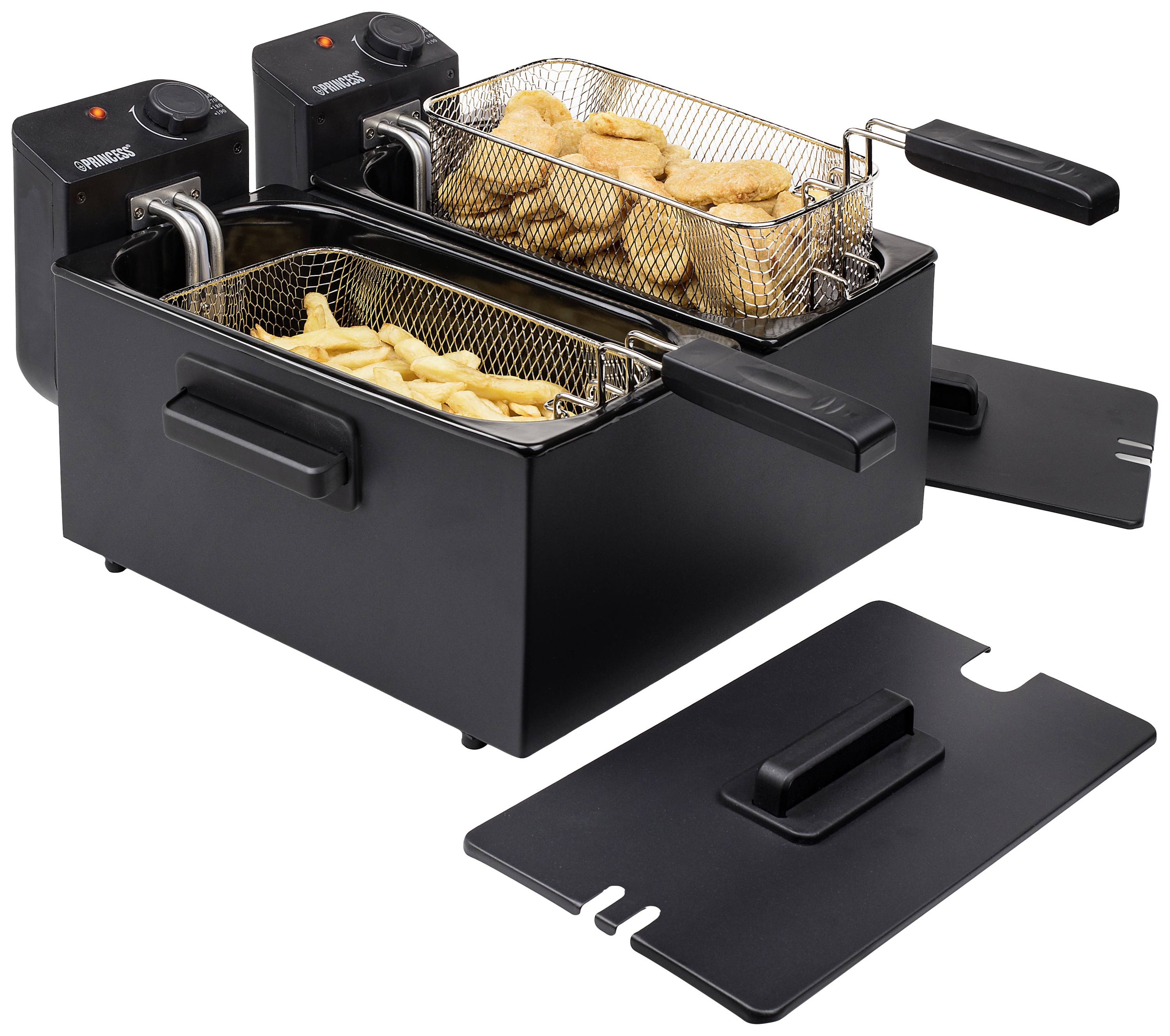 En dubbel fritös med två korgar; en innehåller gyllengula kycklingbitar, den andra pommes frites. Två svarta lock ligger bredvid.