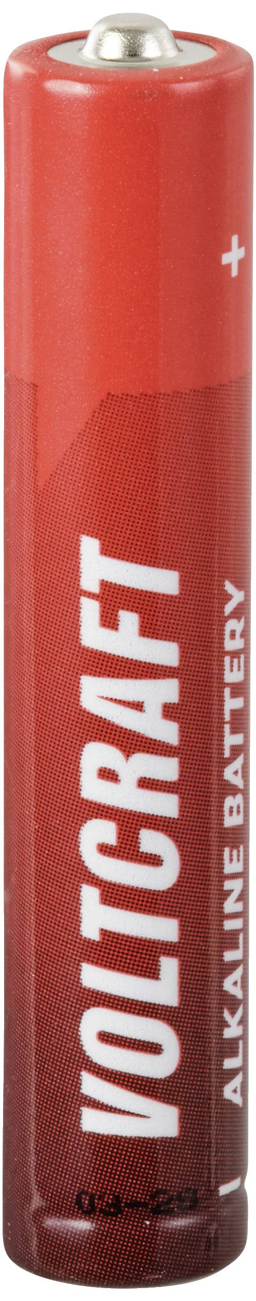 Röd alkalisk batteri med texten 'Voltcraft'. Pluspolen synlig uppifrån.