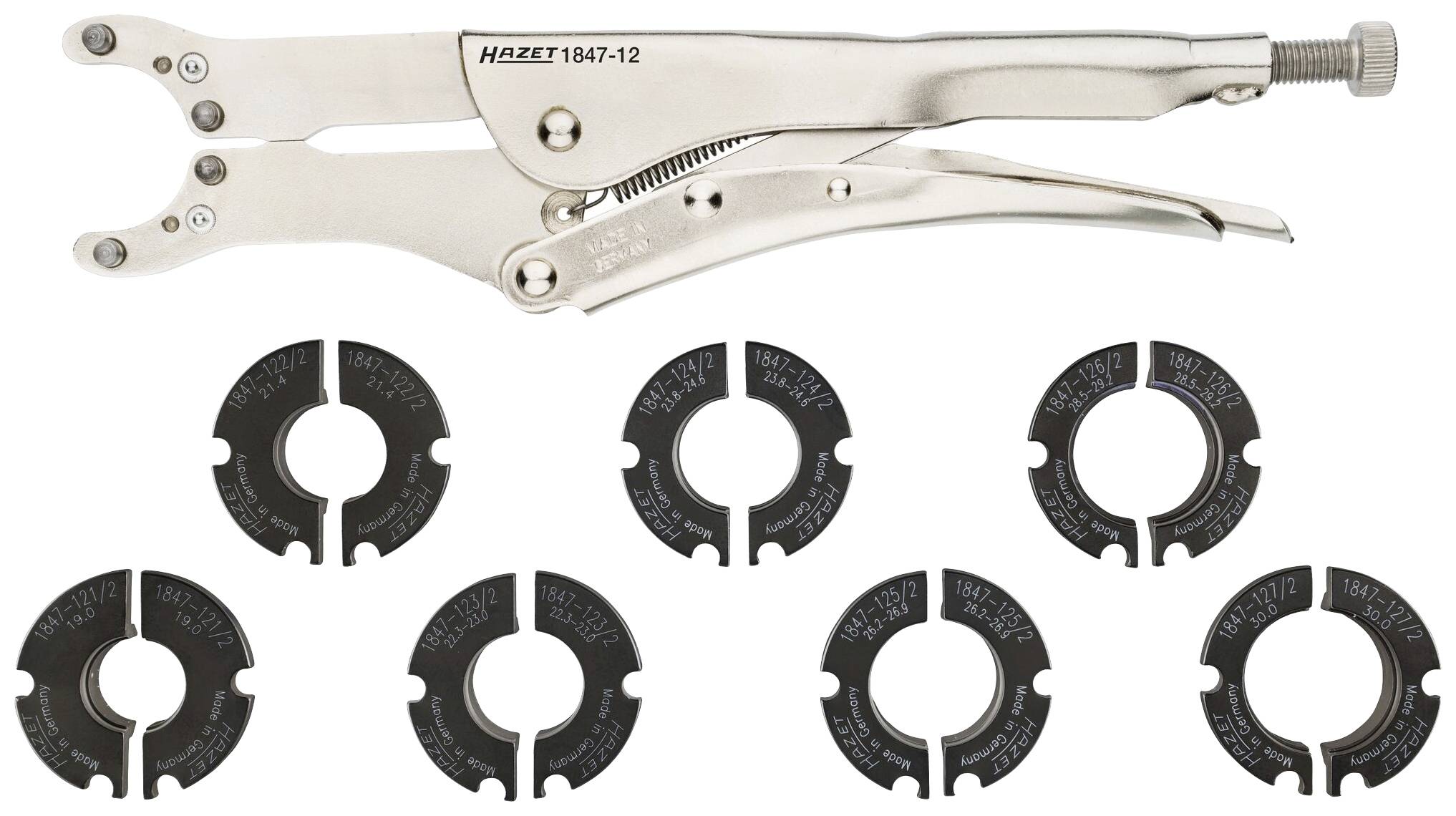 Metalltång och sju svarta, cirkelformade insatser. Insatserna är delade i två halvor och märkta.