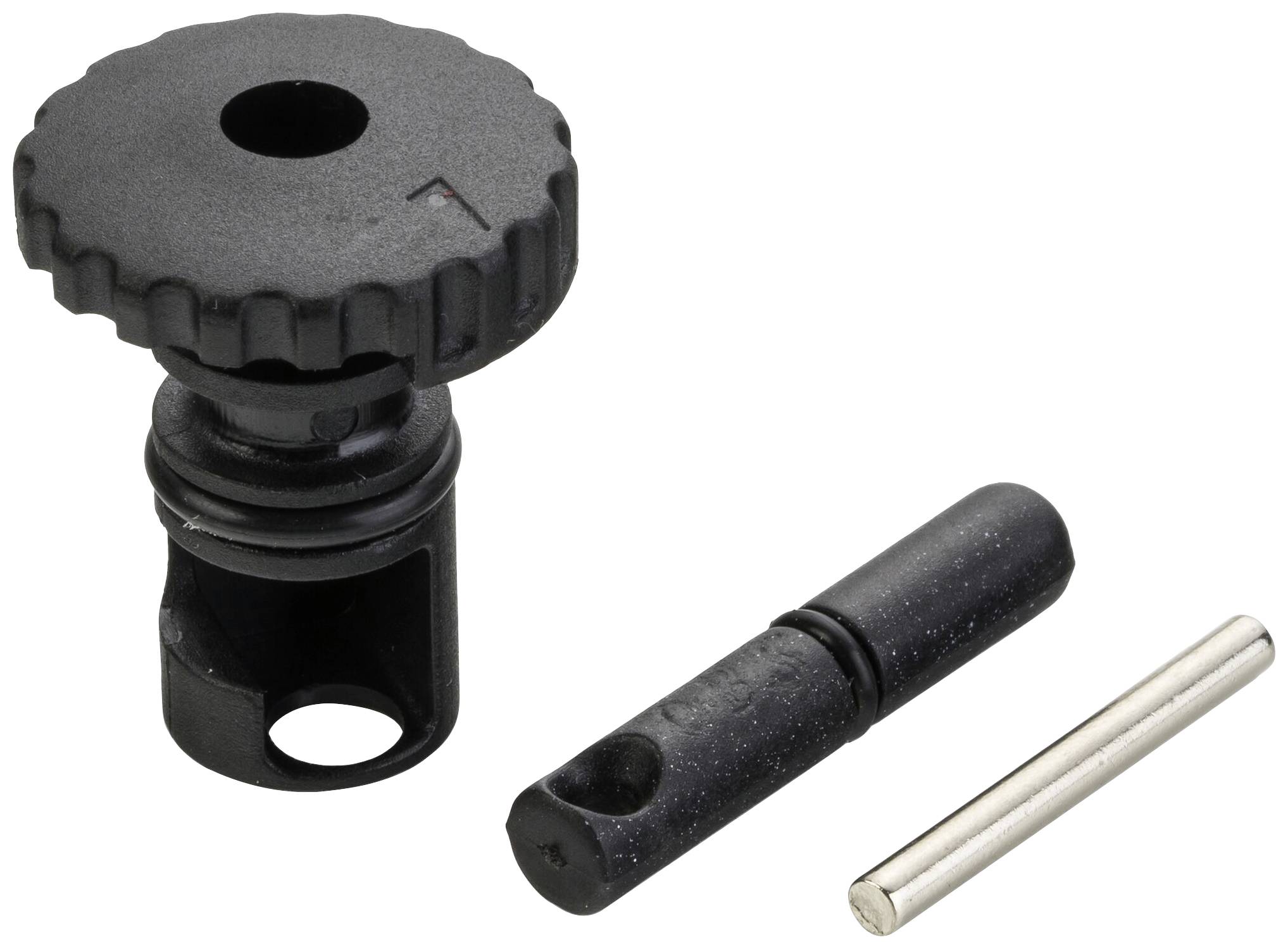 En svart knapp med kugghjulsstruktur och två cylinderformade metallstift, liggande på ljus bakgrund.