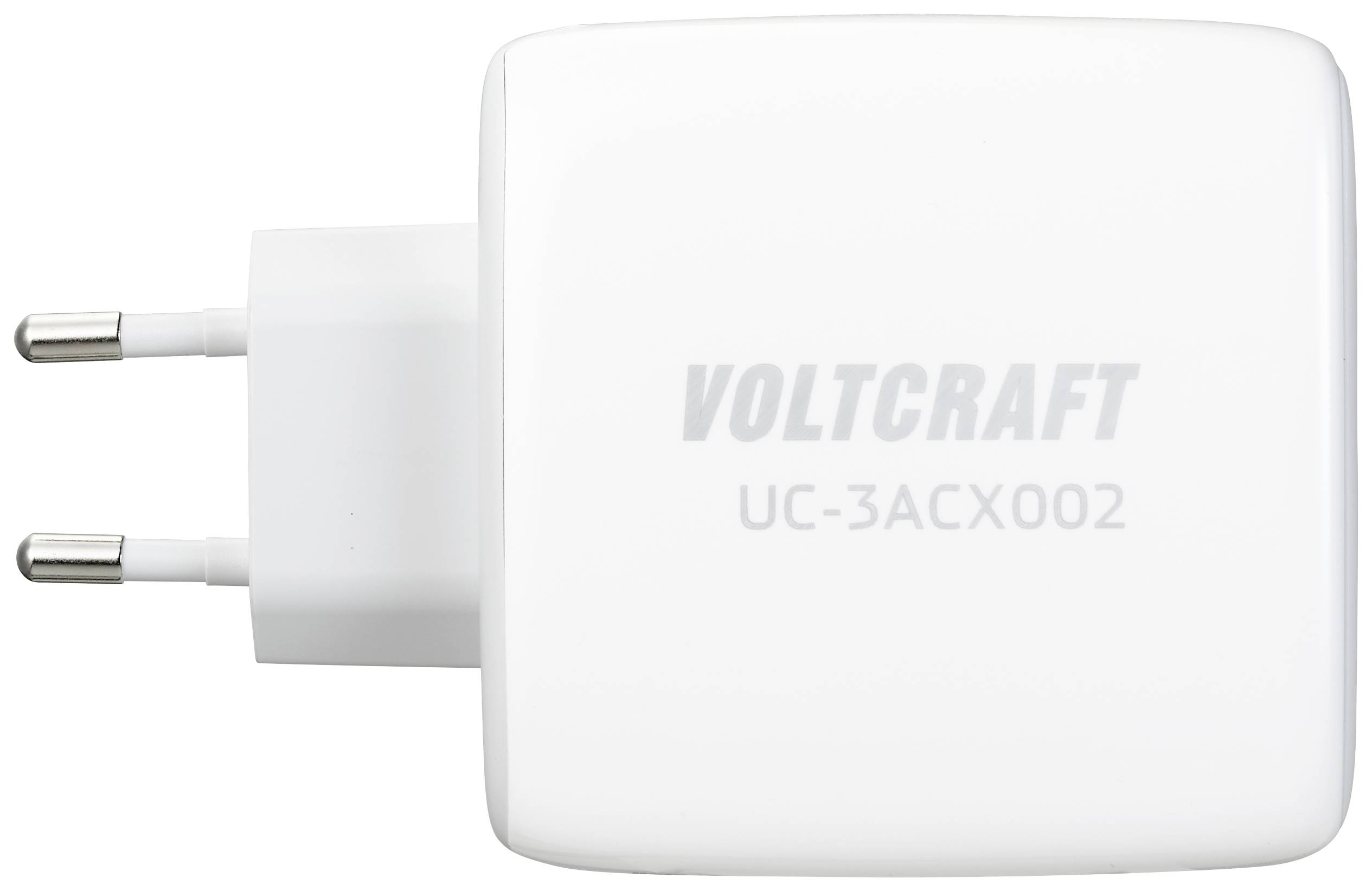 Vitt laddare med två kontakter, märkt med 'Voltcraft UC-3ACX002'.