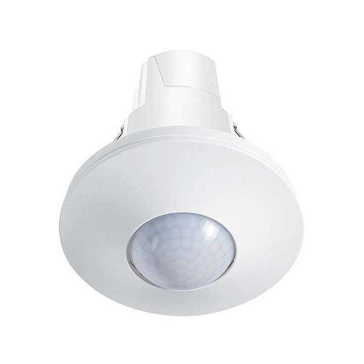 Vit takrörelsedetektor med en rund sensor i mitten, mot en neutral bakgrund. Huvudsakligen använd för belysningsstyrning.