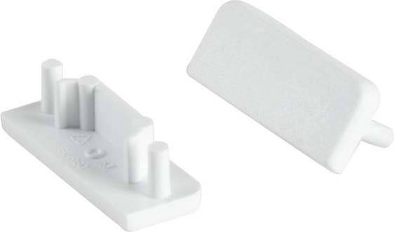 En vit plastdetalj med två framträdande cylindrar och ett plant, rektangulärt område.