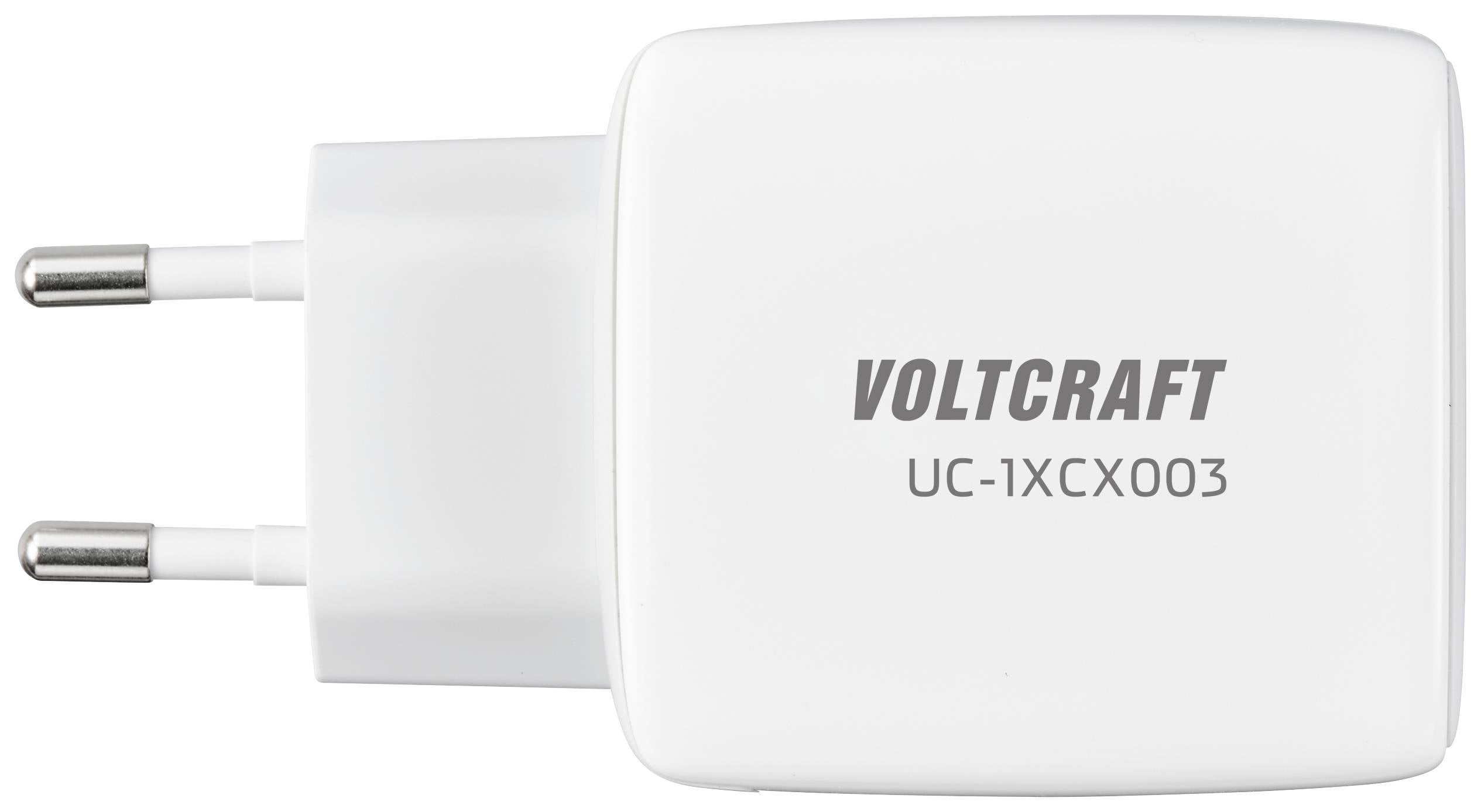 Ett vitt laddningsaggregat från märket Voltcraft, modell UC-1XCX003, med två kontakter för europeiskt vägguttag.
