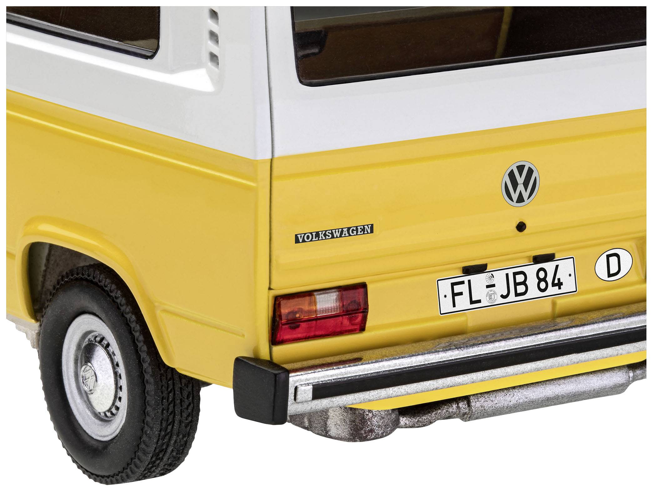 Gul och vit modelsbil, bakifrån med 'Volkswagen'-logotyp och registreringsskylt 'FL JB 84'. Visar detaljer av bilens bakparti.