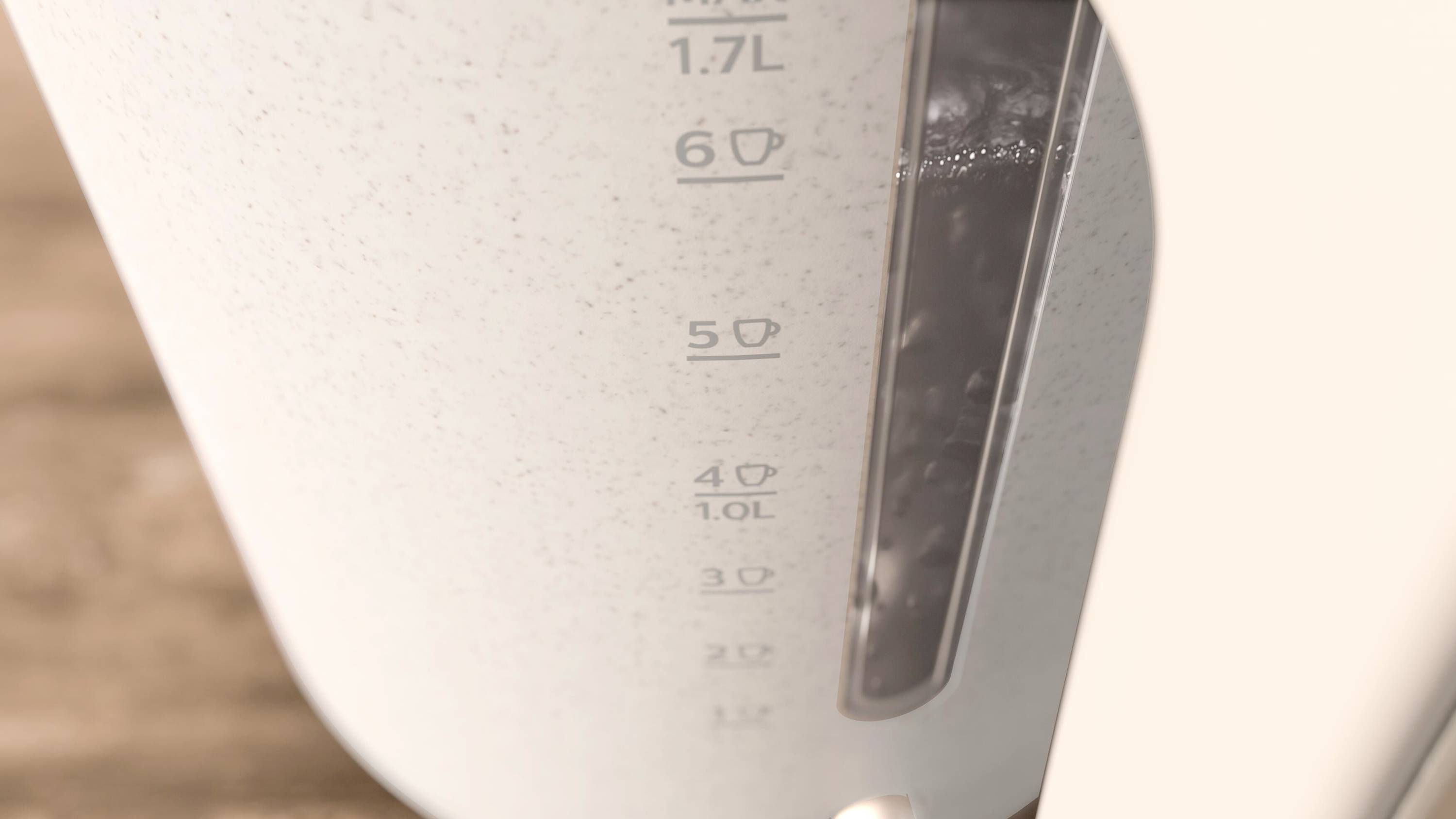 En elektrisk vattenkokare med en skala från 0,2 till 1,7 liter, visar för närvarande ungefär 1,2 liter vatten.