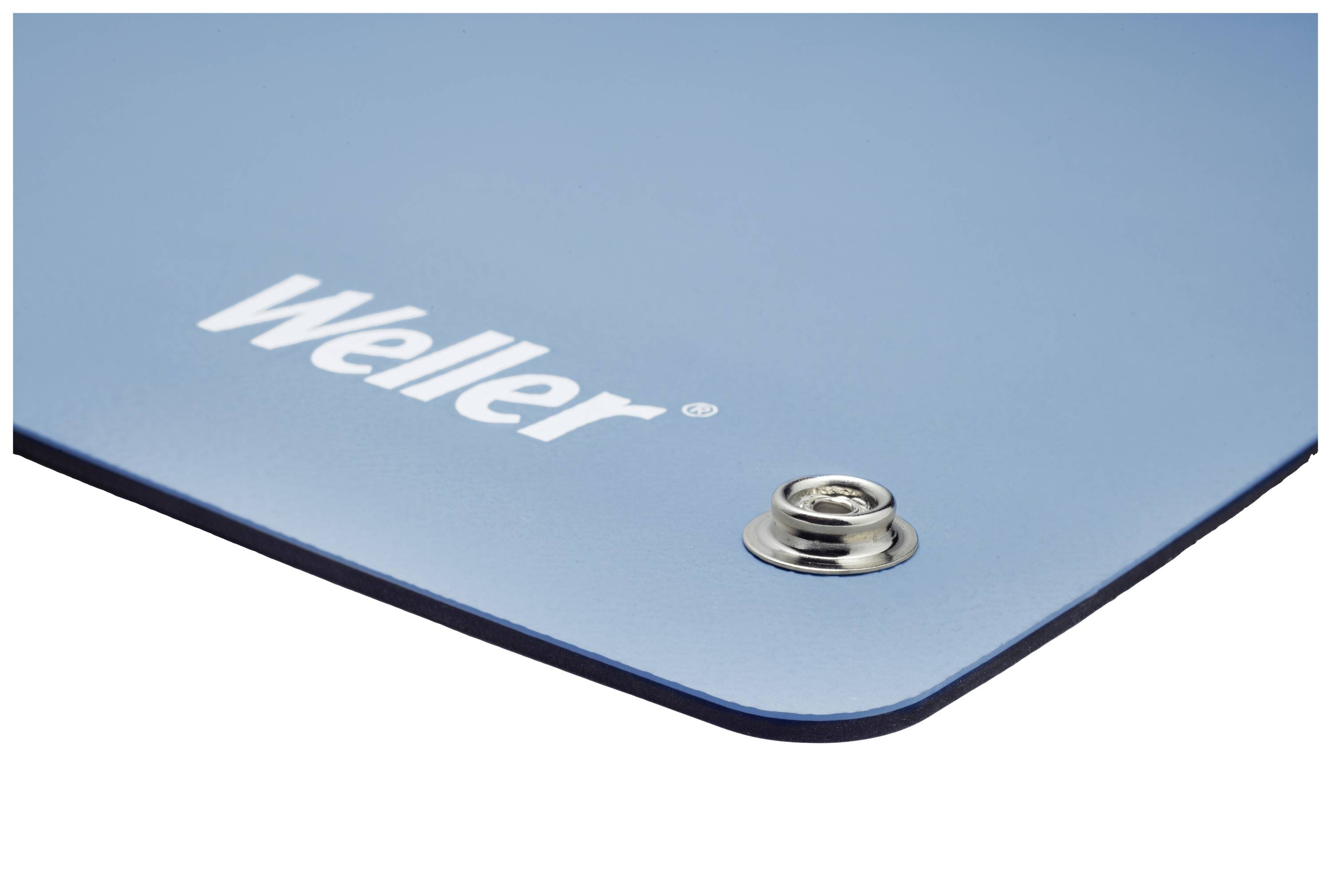Blå Weller-lödmatta med trycknapp i hörnet.